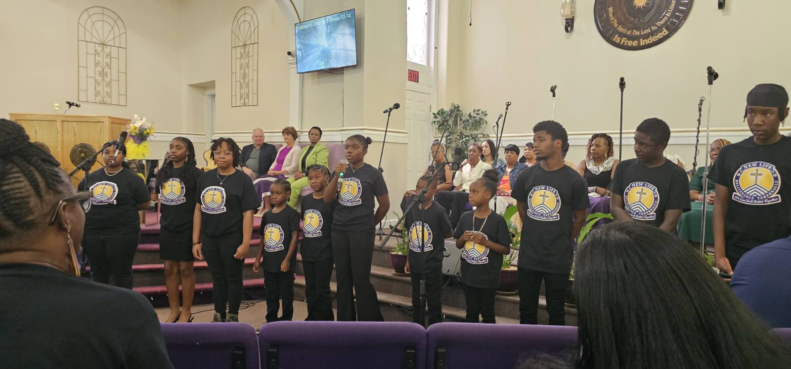 Choir members in custom branded shirts